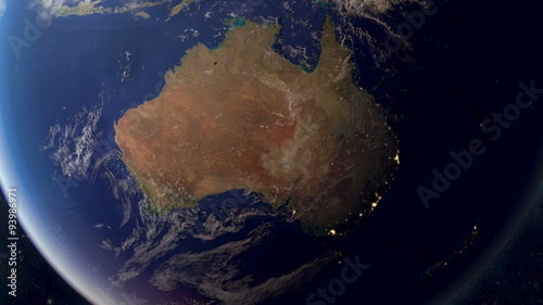 Orbiting over Australia from space. Photorealistic 3d animation, created using extremely high resolution (50k+) textures. As the sun sets you see the cities light up.