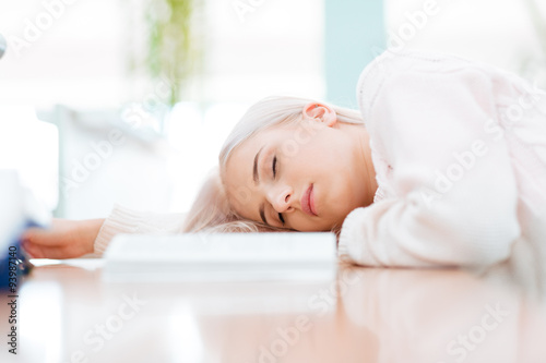 Female student sleeping on the table