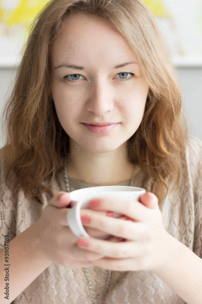 Pretty Girl holding a cup of coffee