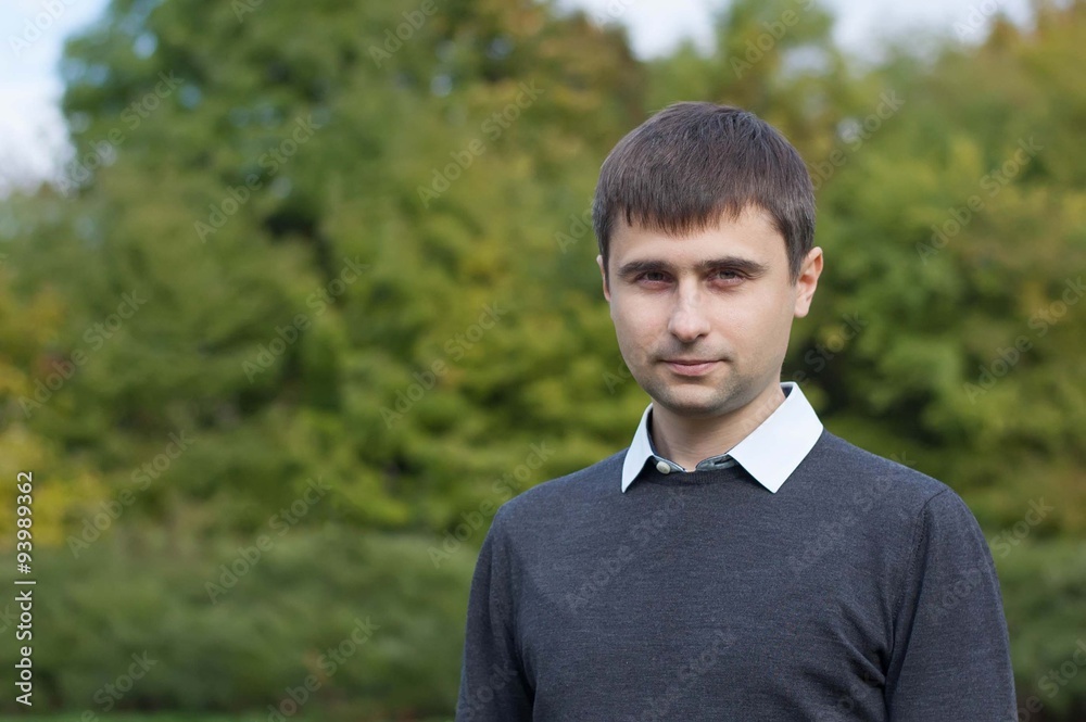Portrait of a young man in autumn park Portrait of a young man in autumn park