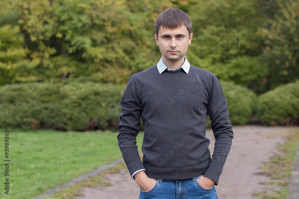 Portrait of a young man in autumn park Portrait of a young man in autumn park