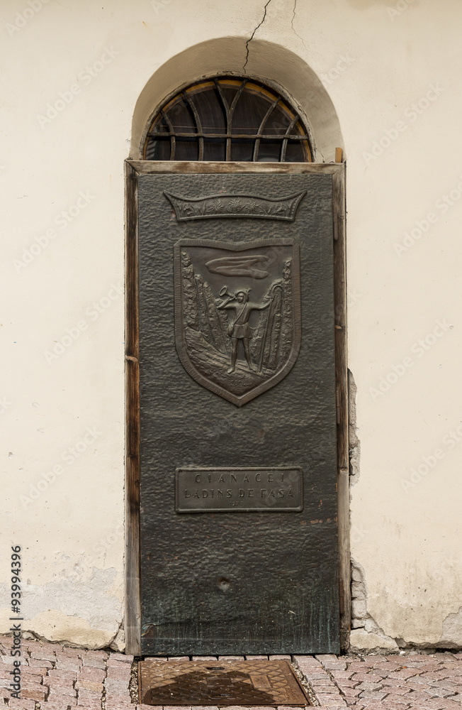 Ancient iron door handle on iron medieval door in Canazei, italy.