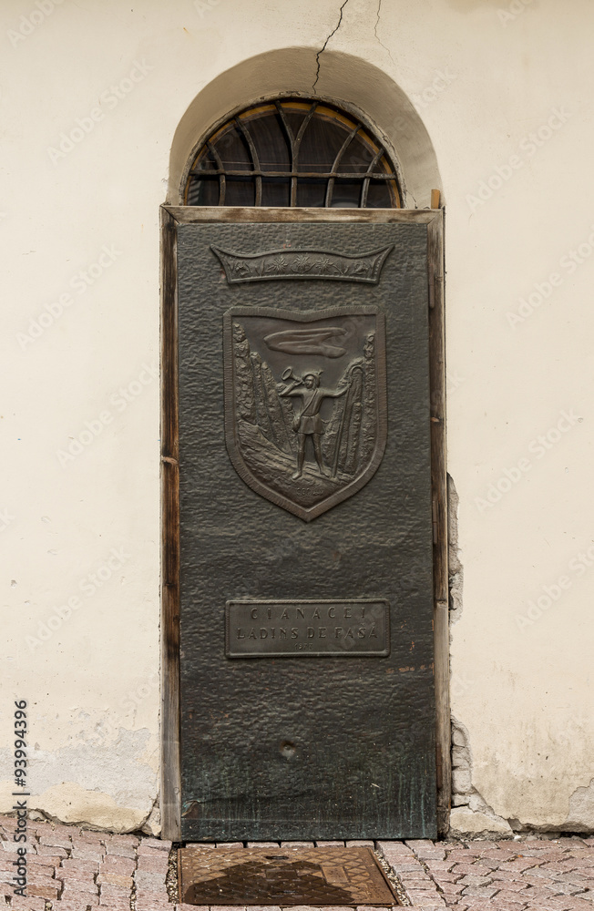 Ancient iron door handle on iron medieval door in Canazei, italy. Ancient iron door handle on iron medieval door in Canazei, italy.