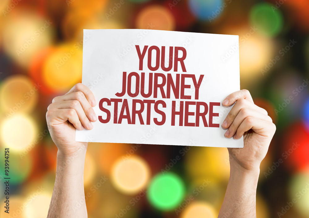 Your Journey Starts Here placard with bokeh background Your Journey Starts Here placard with bokeh background