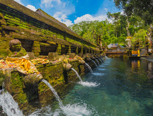 Holy spring water in Tirta Empul temple, Bali, Indonesia photo