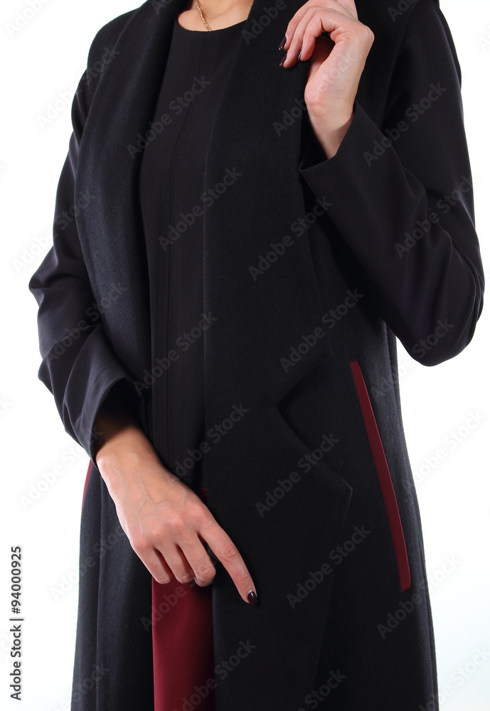 Young model dressed in black autumn coat.