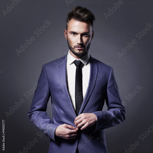 Handsome stylish man in blue suit photo