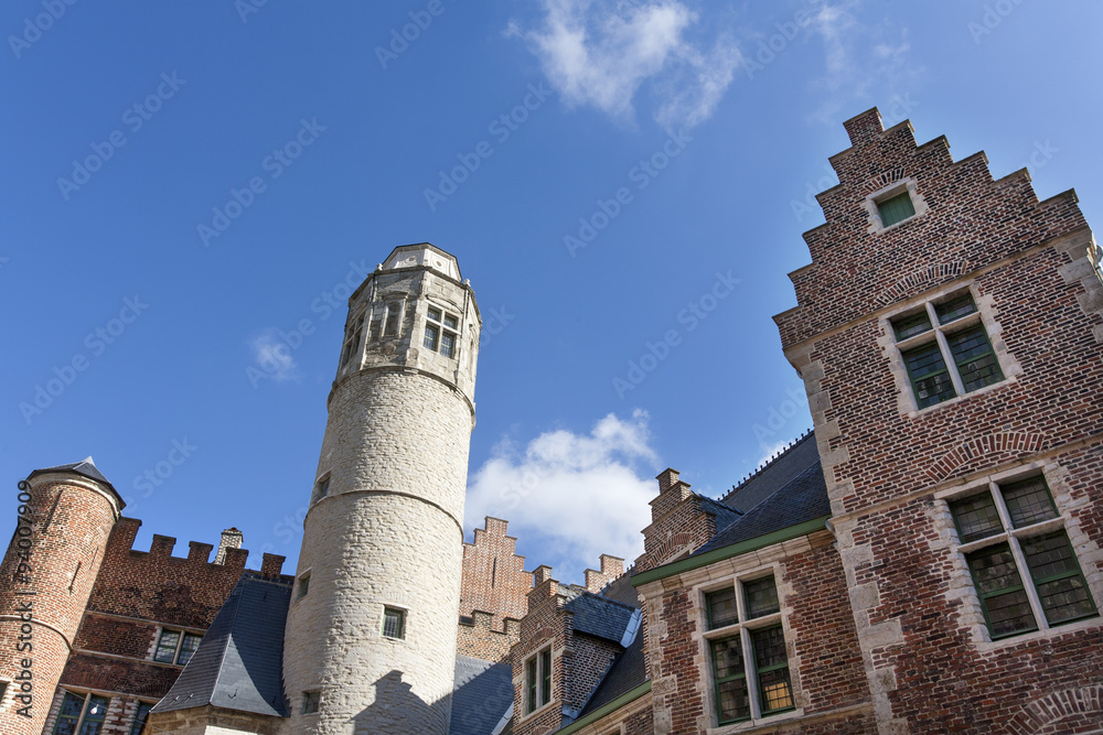 Historic buildings and white tower in Ghent