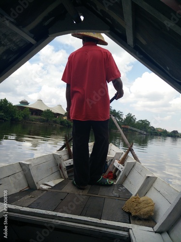 Boatman crossing Sungai Rajang, Sarawak photo