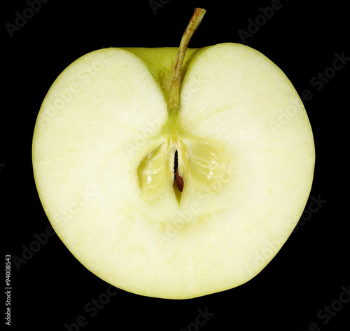 Half an apple isolated on black background.
