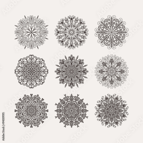 set of 9 circular pattern radial heart flowers snowflakes on a w