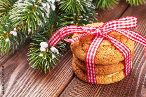 Christmas gingerbread cookies and tree branch