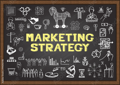 Doodle about Marketing strategy on chalkboard.