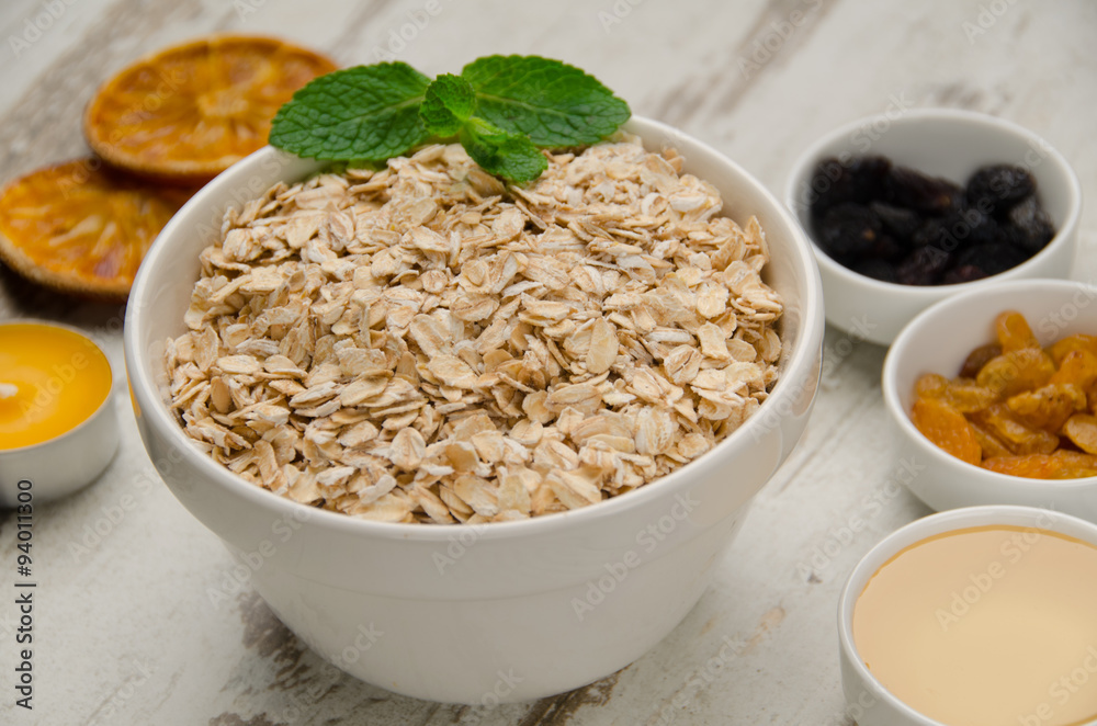 Oatmeal with honey , raisins, mint and orange slice Oatmeal with honey , raisins, mint and orange slice
