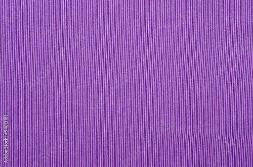 Striped purple textile pattern as a background. Close up on vertical stripes mauve material texture fabric.