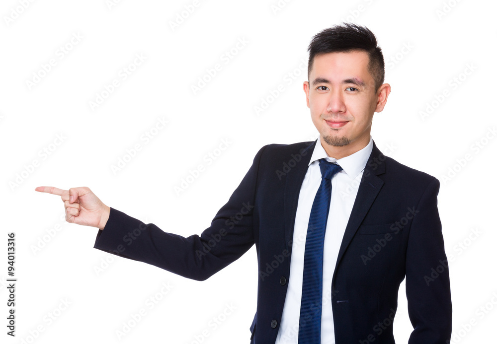 Asian Young businessman with finger point aside Asian Young businessman with finger point aside
