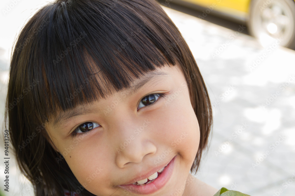 Happy little girl having fun and smiling at the park Happy little girl having fun and smiling at the park