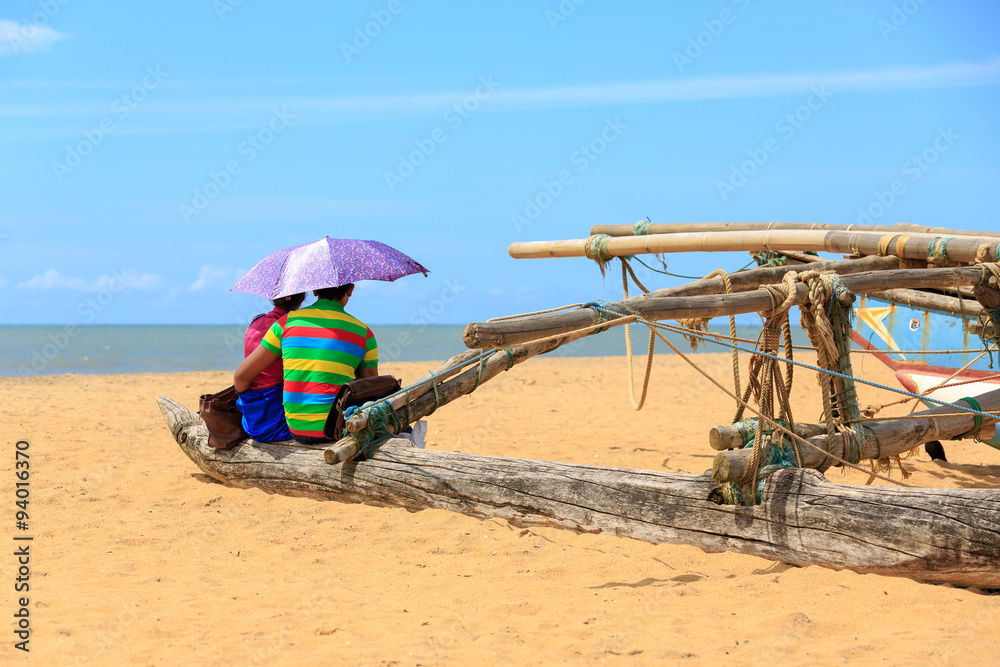 Young couple sitting at the beach Young couple sitting at the beach