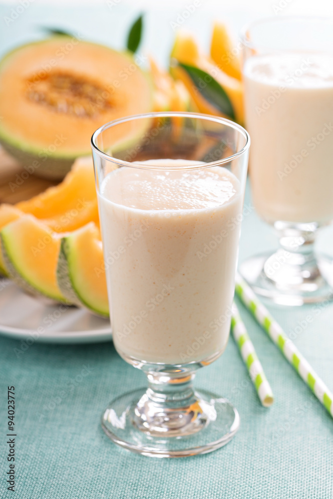 Healthy cantaloupe smoothie in a tall glass Healthy cantaloupe smoothie in a tall glass