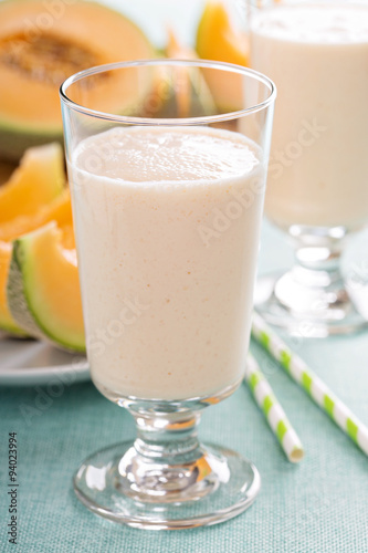 Healthy cantaloupe smoothie in a tall glass