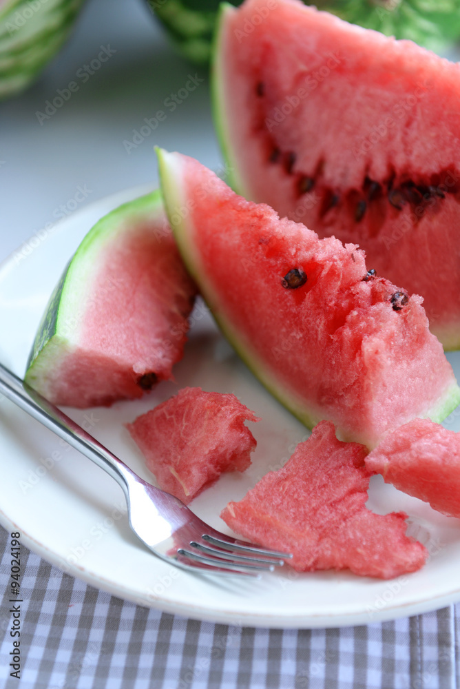 Sliced watermelon on plate closeup