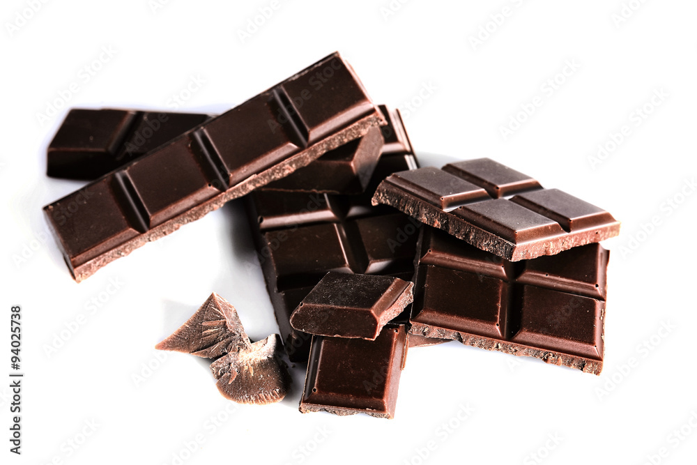 Milk chocolate pieces isolated on white background Milk chocolate pieces isolated on white background