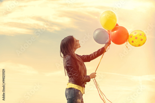 happy girl with balloons