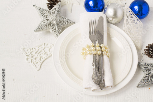 Christmas and New year table place setting with christmas decora