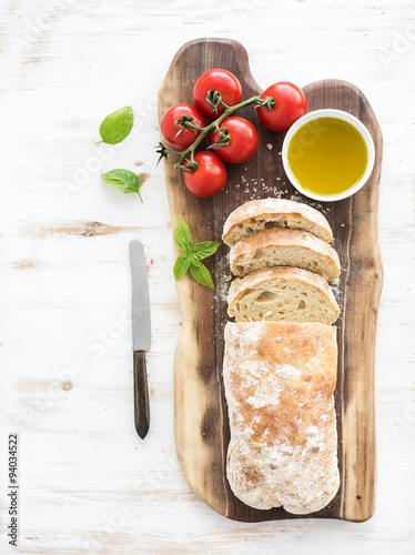 Freshly baked ciabatta bread with cherry-tomatoes, olive oil