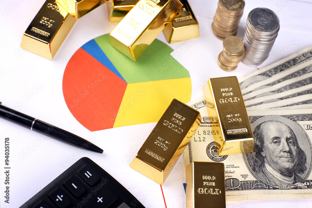 Gold bullion with money on table close up