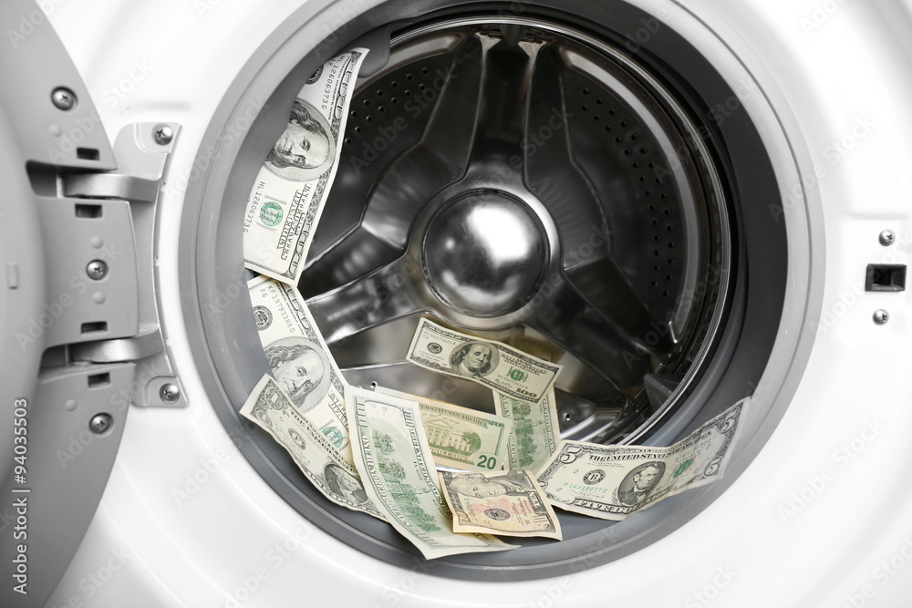 Dirty dollars in washing machine, close up