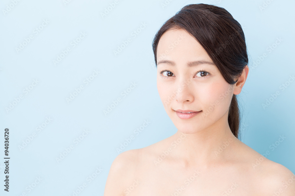 attractive asian woman beauty image on blue background attractive asian woman beauty image on blue background
