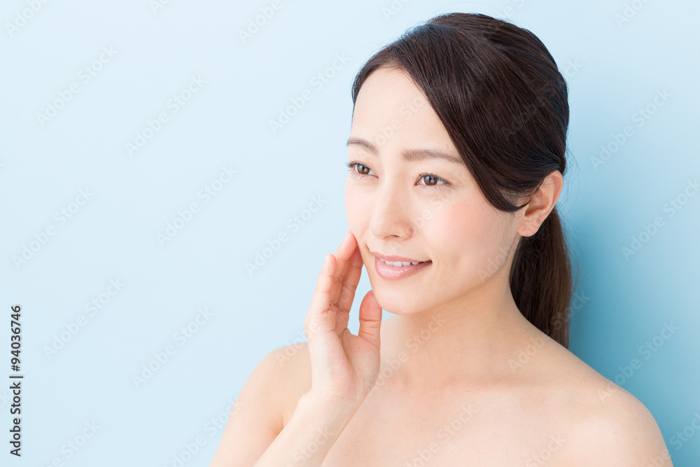 attractive asian woman beauty image on blue background attractive asian woman beauty image on blue background