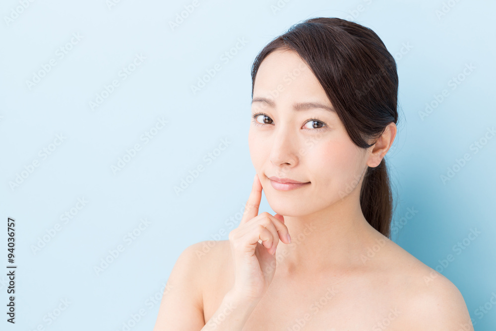 attractive asian woman beauty image on blue background attractive asian woman beauty image on blue background