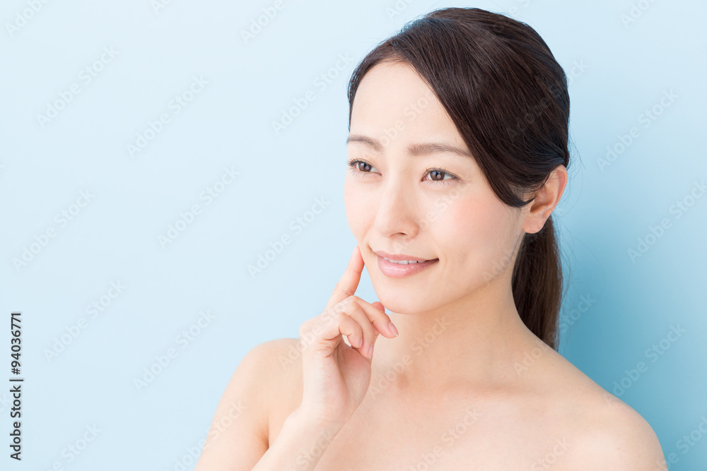 attractive asian woman beauty image on blue background attractive asian woman beauty image on blue background