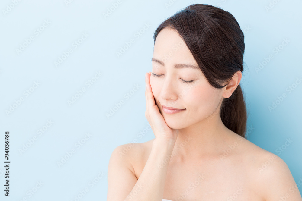 attractive asian woman beauty image on blue background attractive asian woman beauty image on blue background