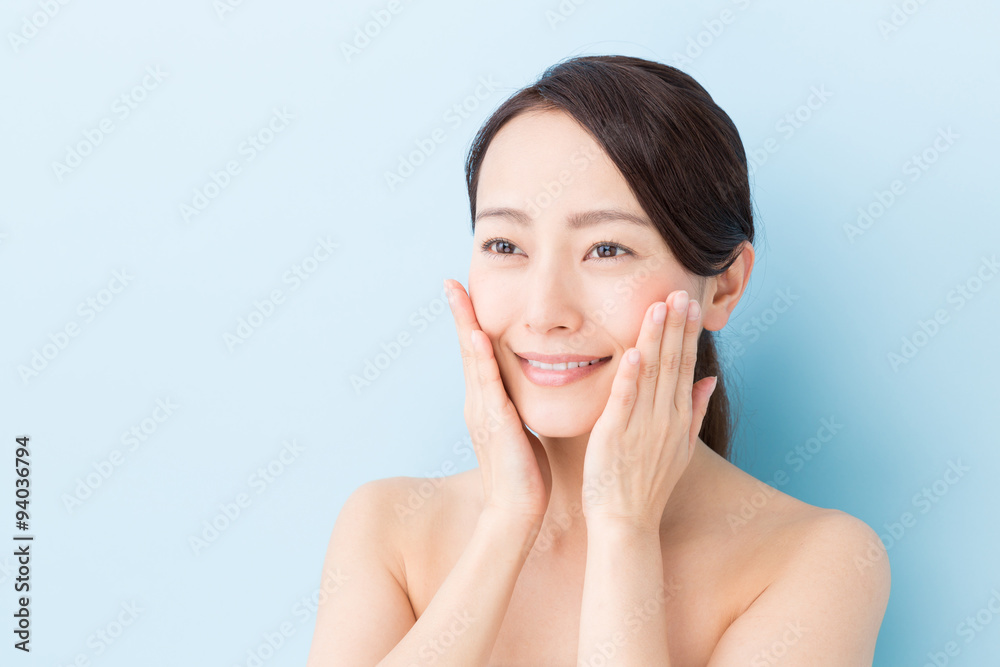 attractive asian woman beauty image on blue background attractive asian woman beauty image on blue background