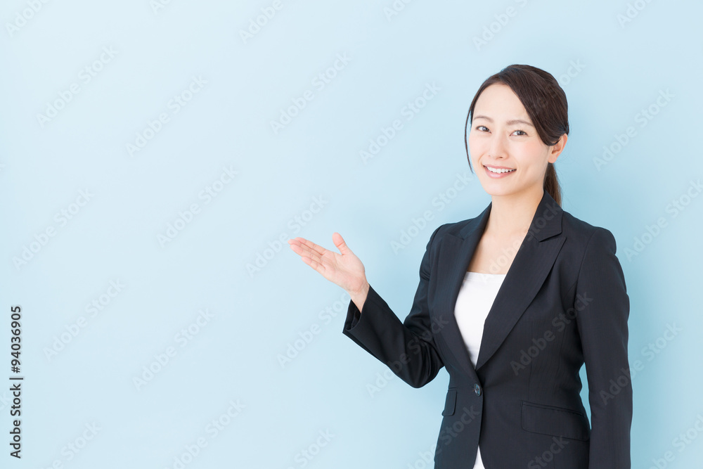 portrait of asian businesswoman on blue background portrait of asian businesswoman on blue background