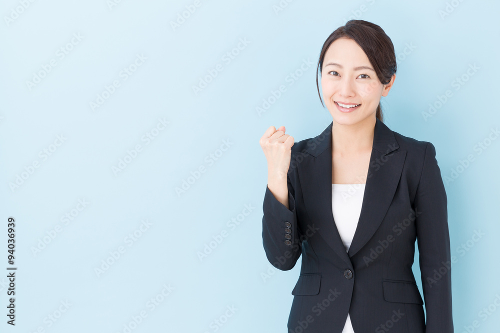 portrait of asian businesswoman on blue background portrait of asian businesswoman on blue background