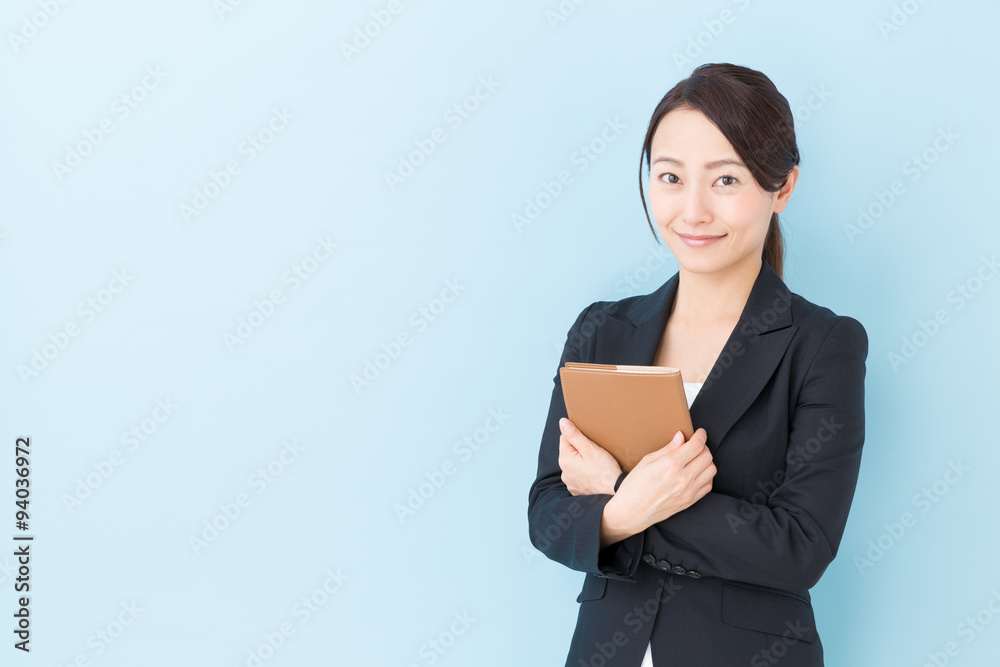 portrait of asian businesswoman on blue background portrait of asian businesswoman on blue background