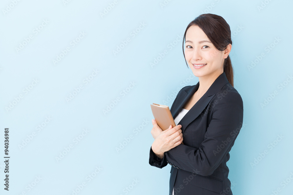 portrait of asian businesswoman on blue background portrait of asian businesswoman on blue background