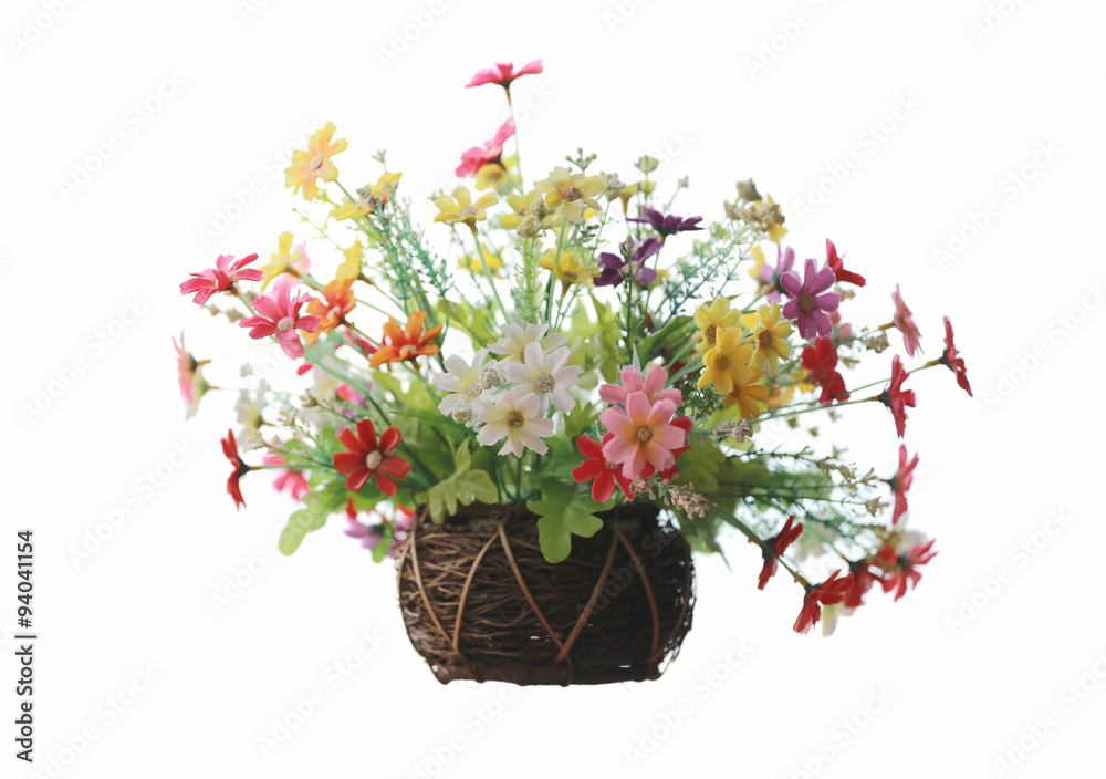 Artificial colorful flowers in jardiniere for decoration house.