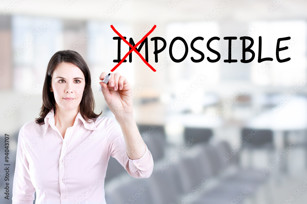 Businesswoman choosing Possible instead of Impossible. Office background. Businesswoman choosing Possible instead of Impossible. Office background.