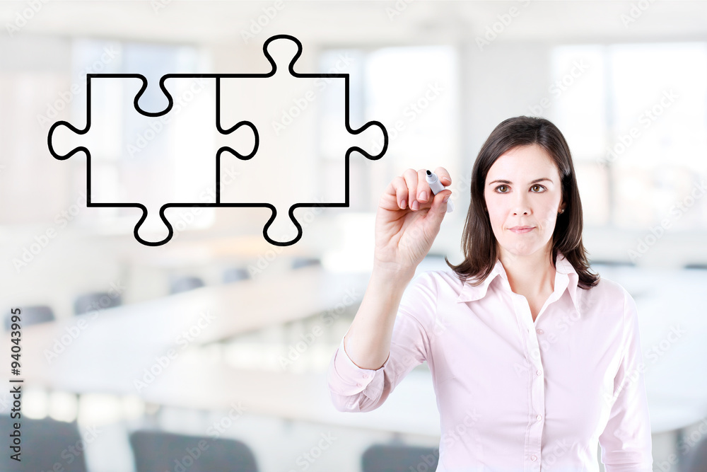 Businesswoman drawing a Blank Puzzle on the screen. Office background. Businesswoman drawing a Blank Puzzle on the screen. Office background.