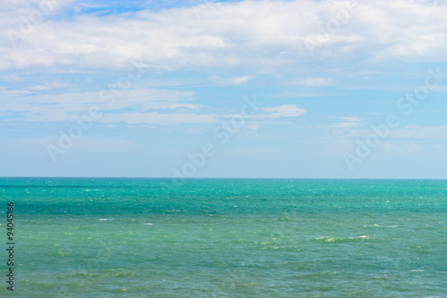 Blue sea with waves and clear blue sky. Beautiful sky and ocean.
