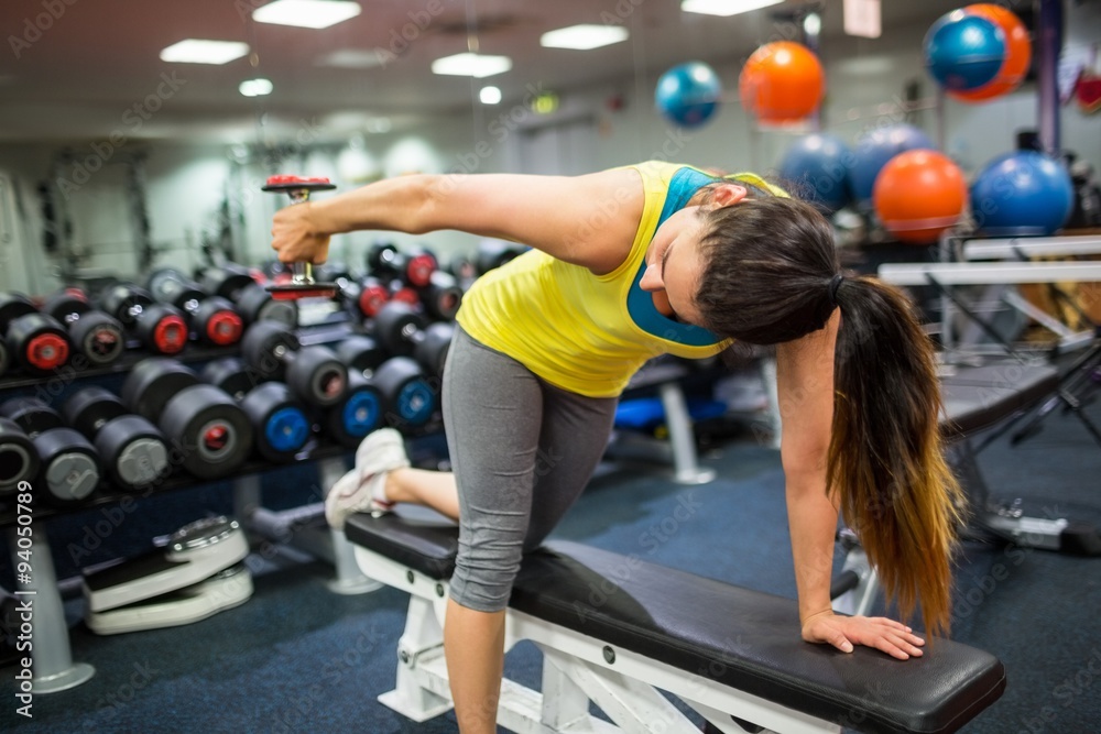 Woman doing a workout with dumbbells Woman doing a workout with dumbbells