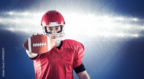 Composite image of american football player showing ball