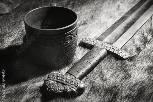 Viking sword and stein on a fur photo