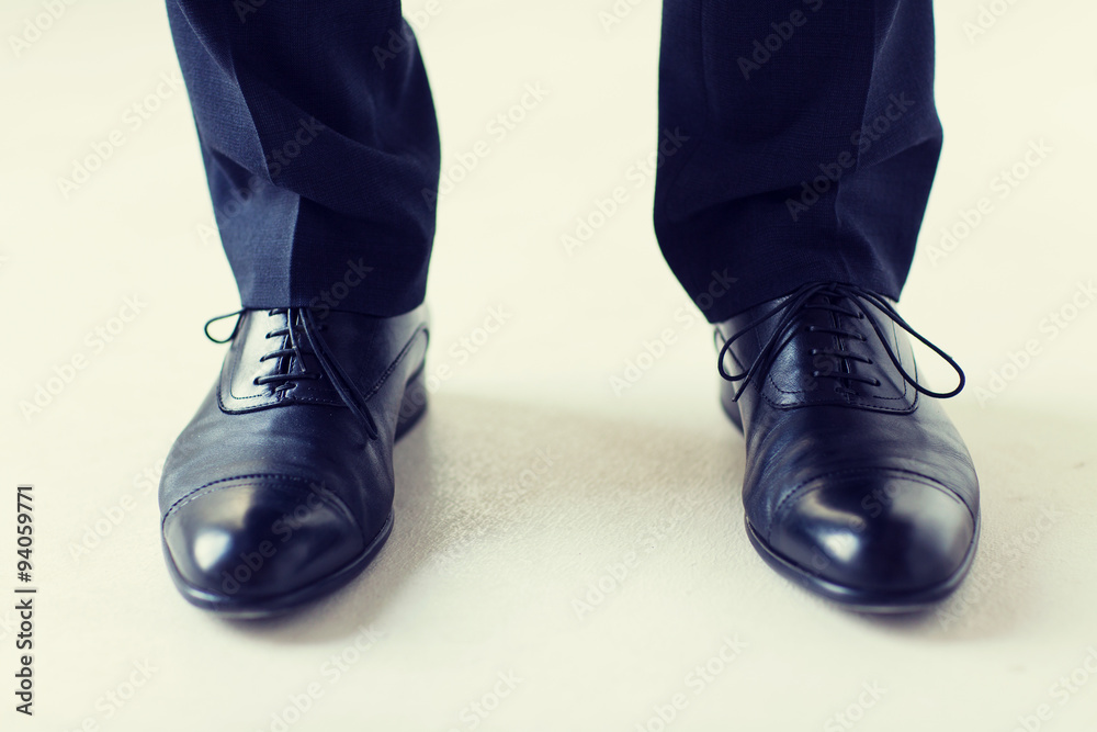 close up of man legs in elegant shoes with laces