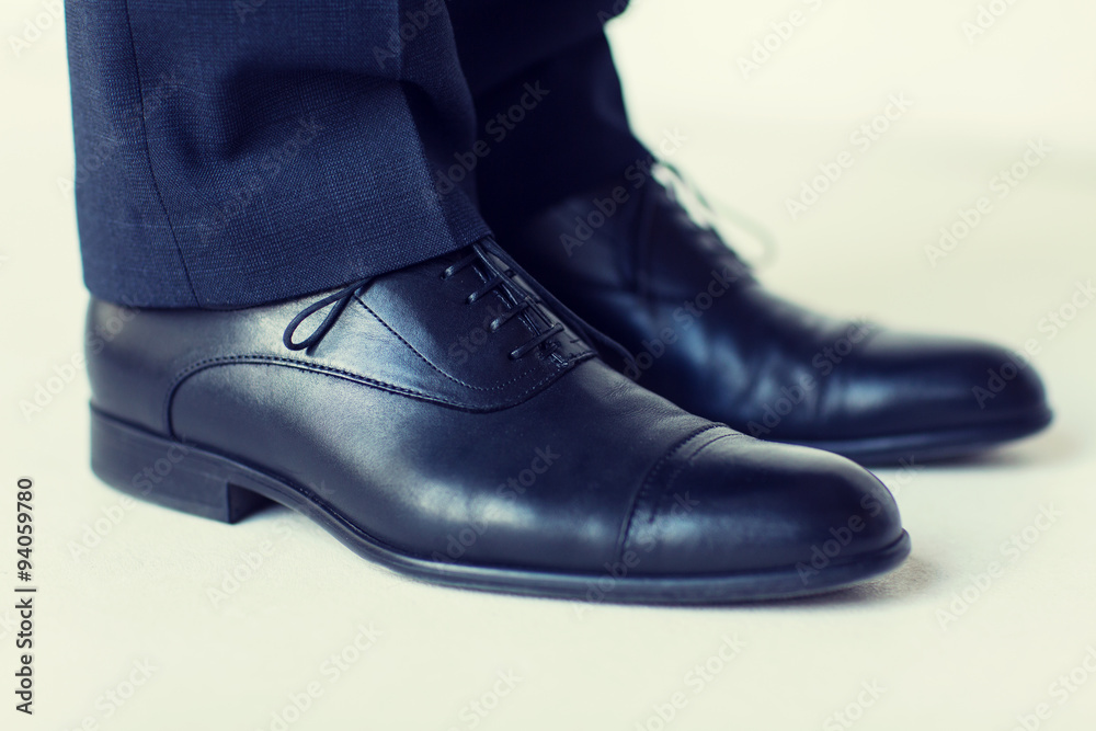 close up of man legs in elegant shoes with laces